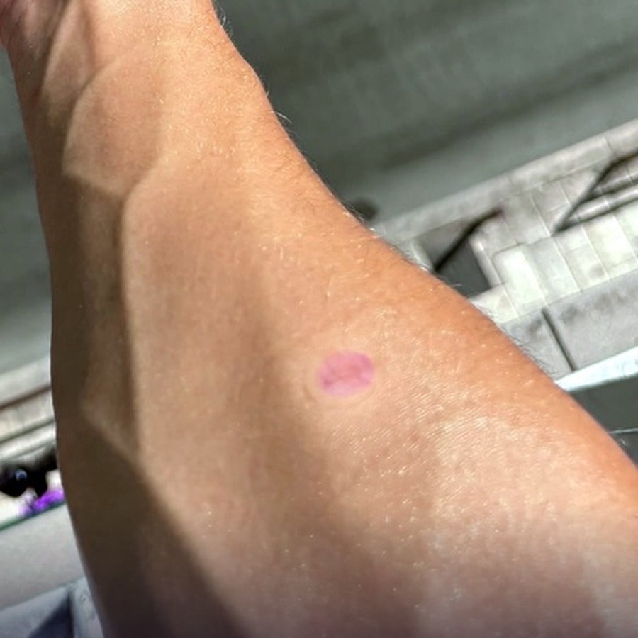 Tester photo: a patch sitting pale lilac thirty minutes after SPF 30 went on over the top.